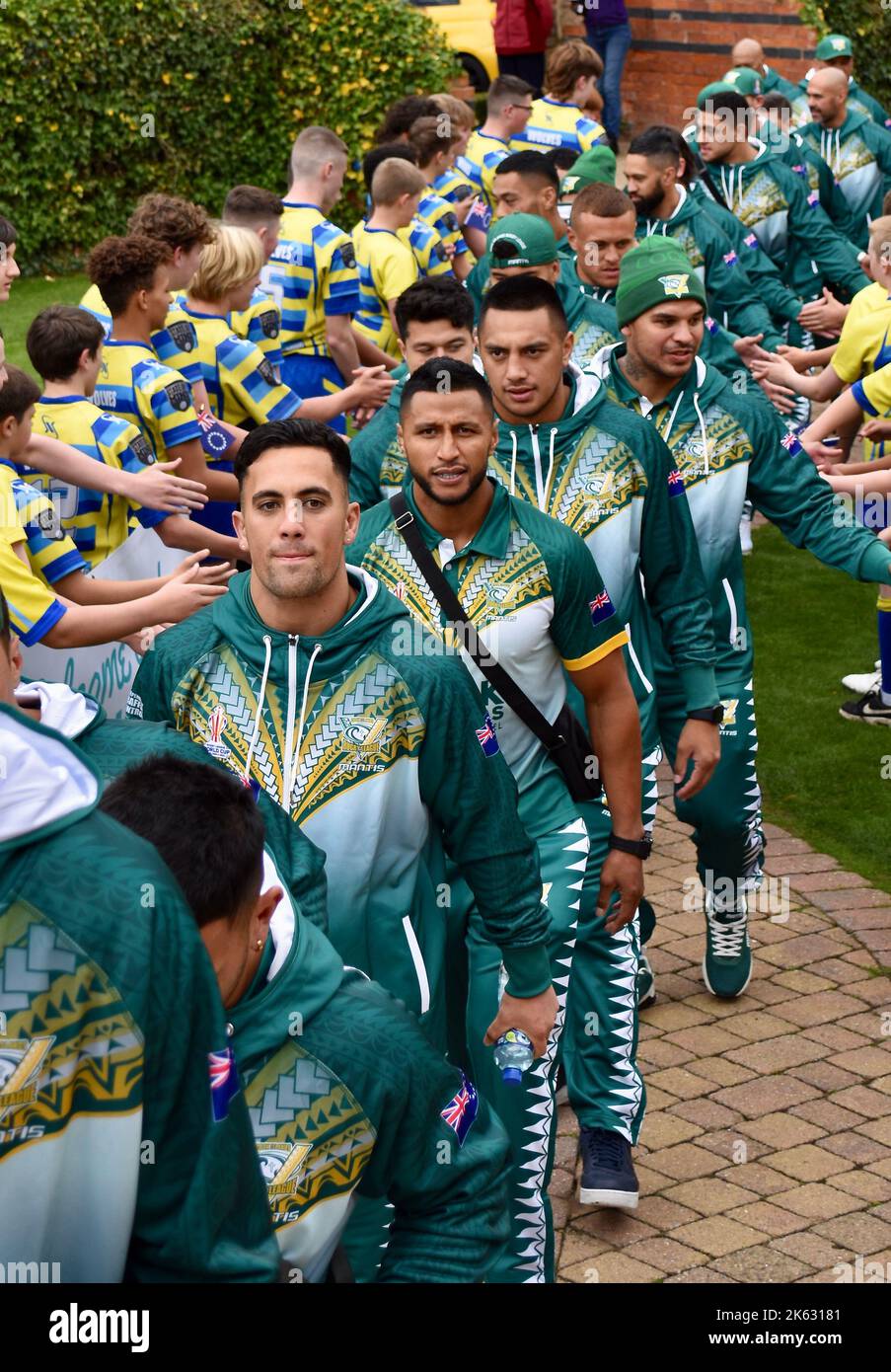 Darlington, UK. 11 Oct 2022. The Cook Islands men’s Rugby League World Cup team have arrived at Rockliffe Hall, where they will be based for three weeks during their RLWC2021 campaign which includes a game against rivals Tonga at Middlesbrough’s Riverside Stadium. The squad were greeted with a youth brass band and young players from Yarm Wolves before meeting local representatives and the media. They also performed the Haka. Credit: Teesside Snapper/Alamy Live News Stock Photo