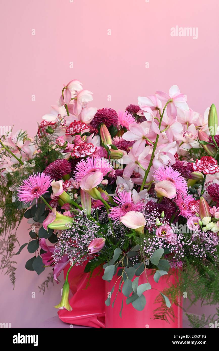 Pink and red Orchid, Gerbera, Calla and Dianthus bouquet. Stock Photo