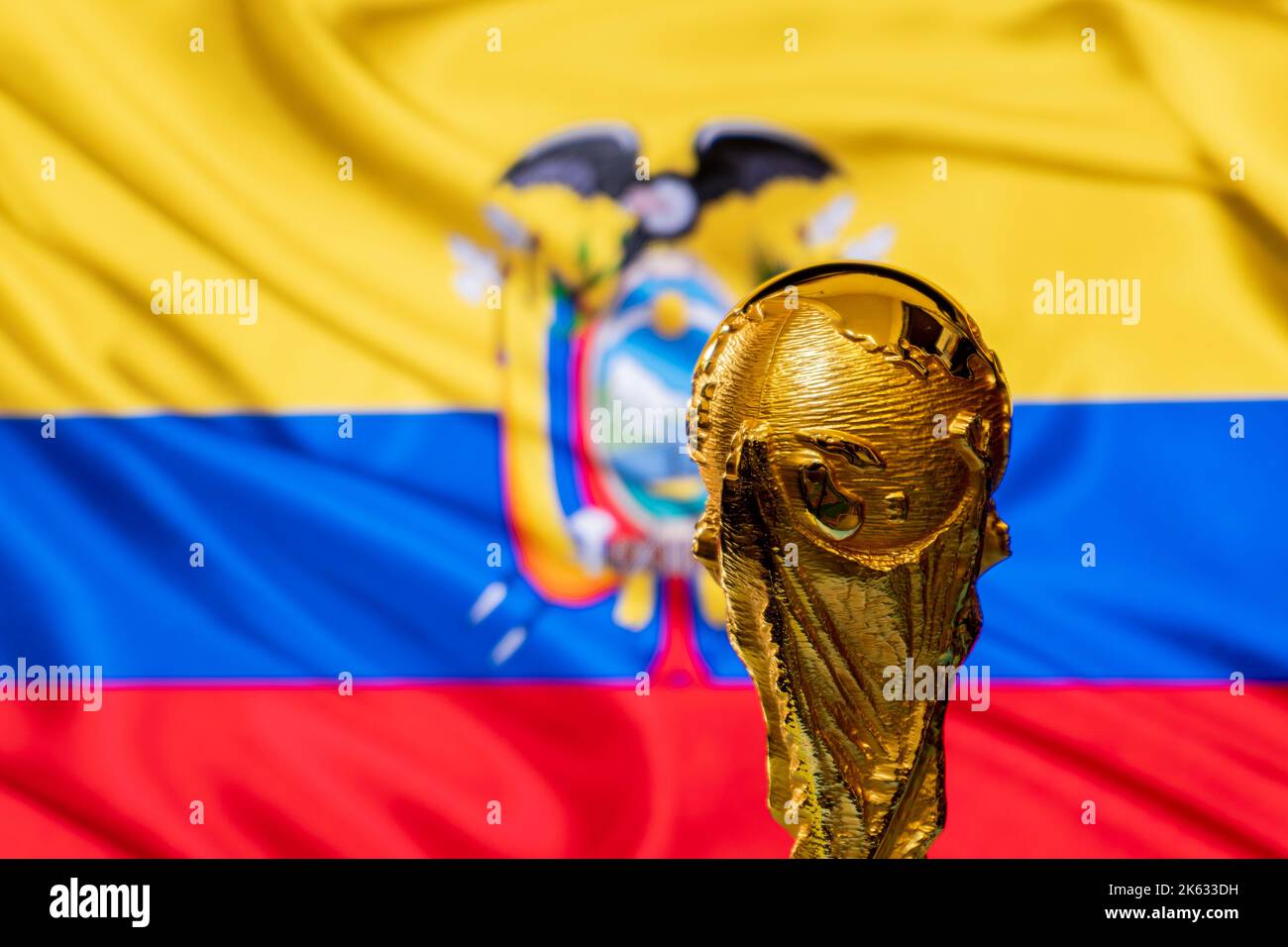 FIFA World Cup trophy against the background of Ecuador flag. Stock Photo