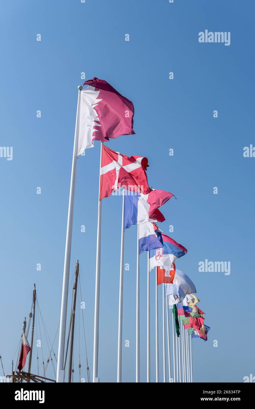 Flags of nations qualified for World Cup Qatar 2022 hoisted at Doha Corniche, Qatar. Stock Photo