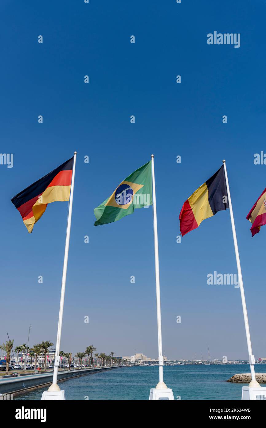 Flags of nations qualified for World Cup Qatar 2022 hoisted at Doha Corniche, Qatar. Stock Photo