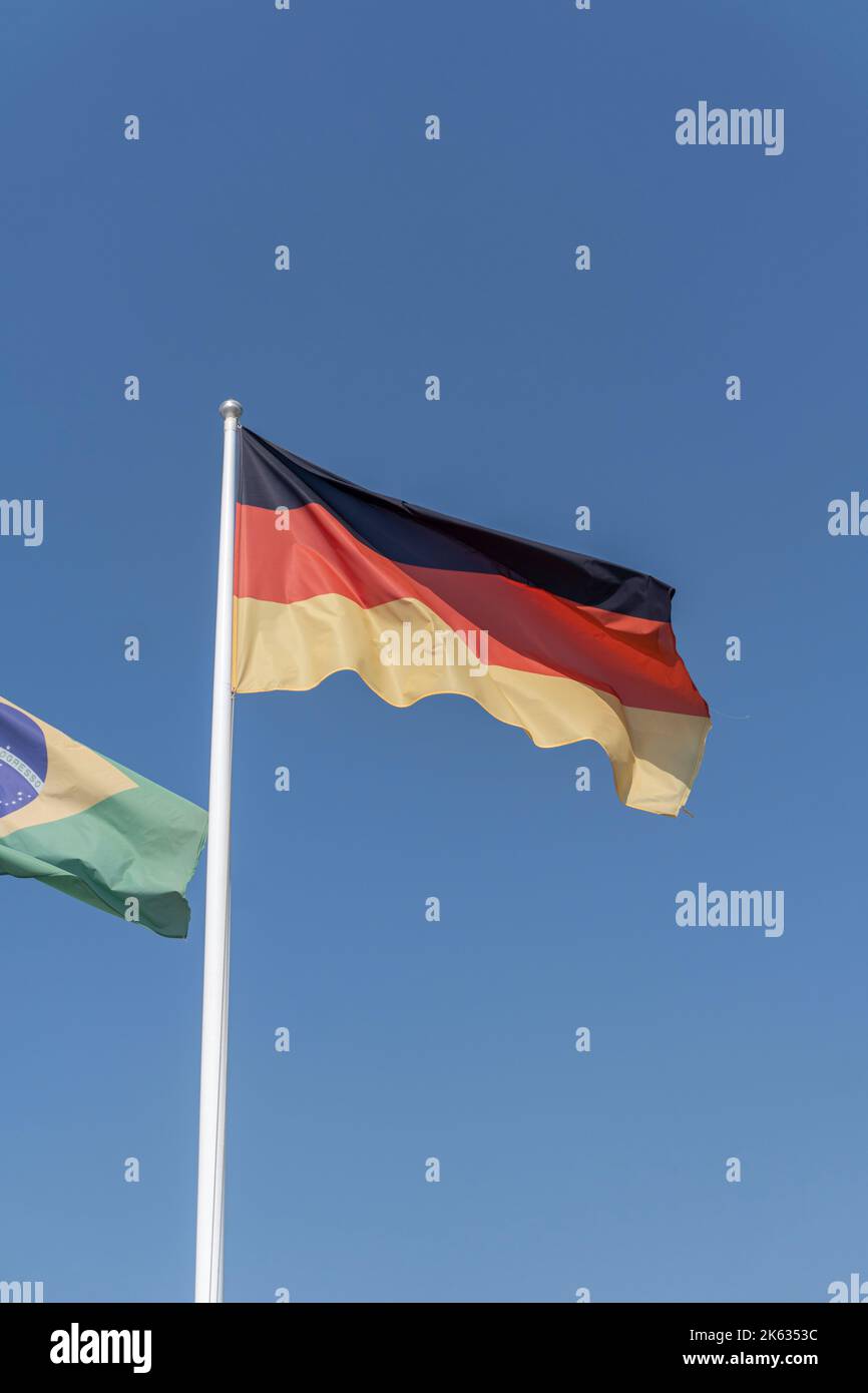 The national flag of Germany. Consisting of three equal horizontal bands displaying the national colours of Germany: black, red, and gold. Stock Photo