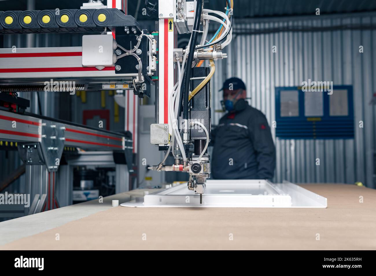 Perm, Russia - September 21, 2022: industrial robotic dosing dispenser machine, dispensing system robot at work Stock Photo