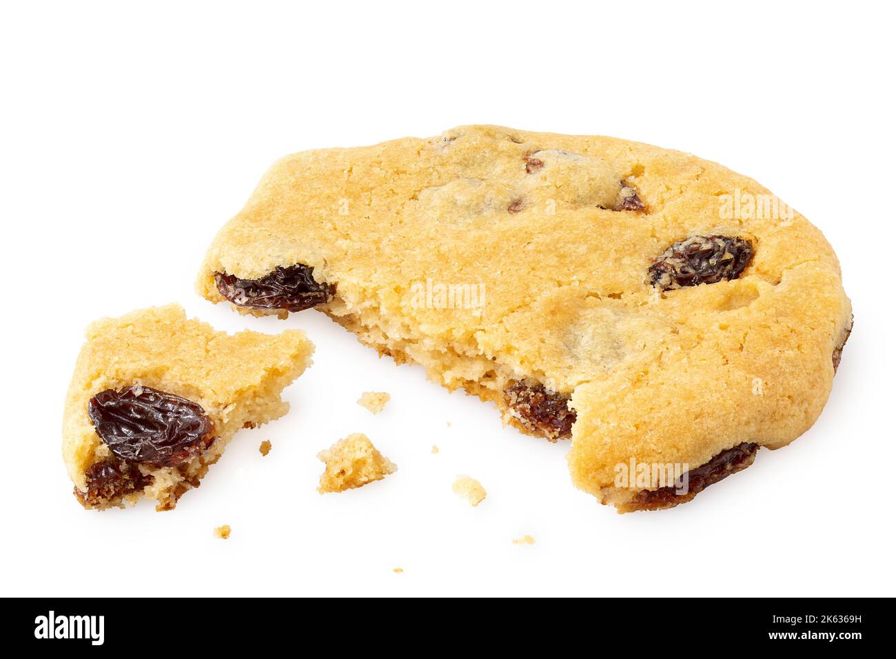 Partially eaten all butter sultana cookie with crumbs isolated on white. Stock Photo