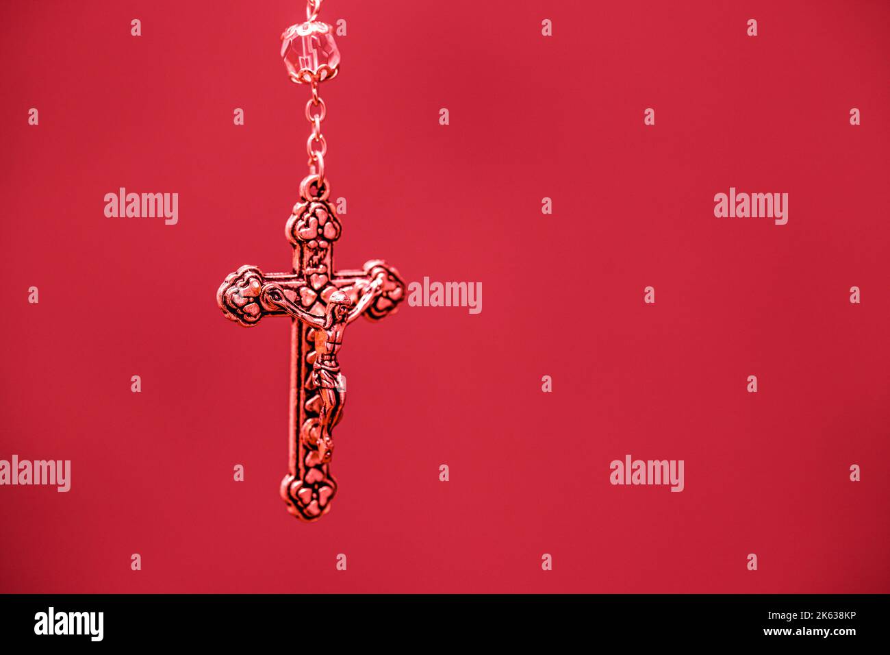 detail of a crucifix, colored background, christian symbol, with ...