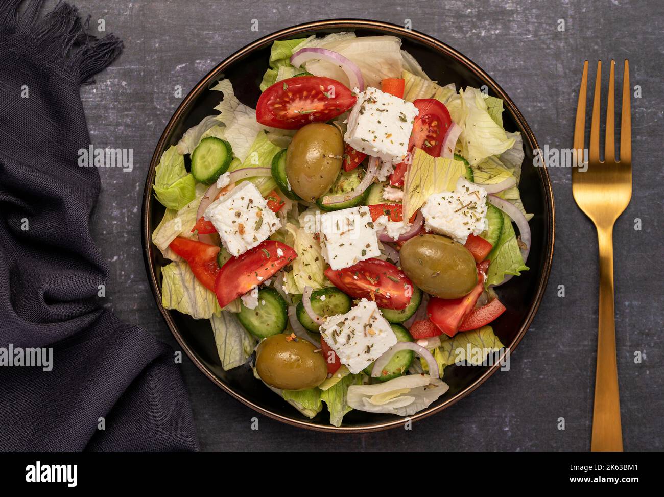 Macro food photography of greek salad, feta, tomato, cucumber, onion