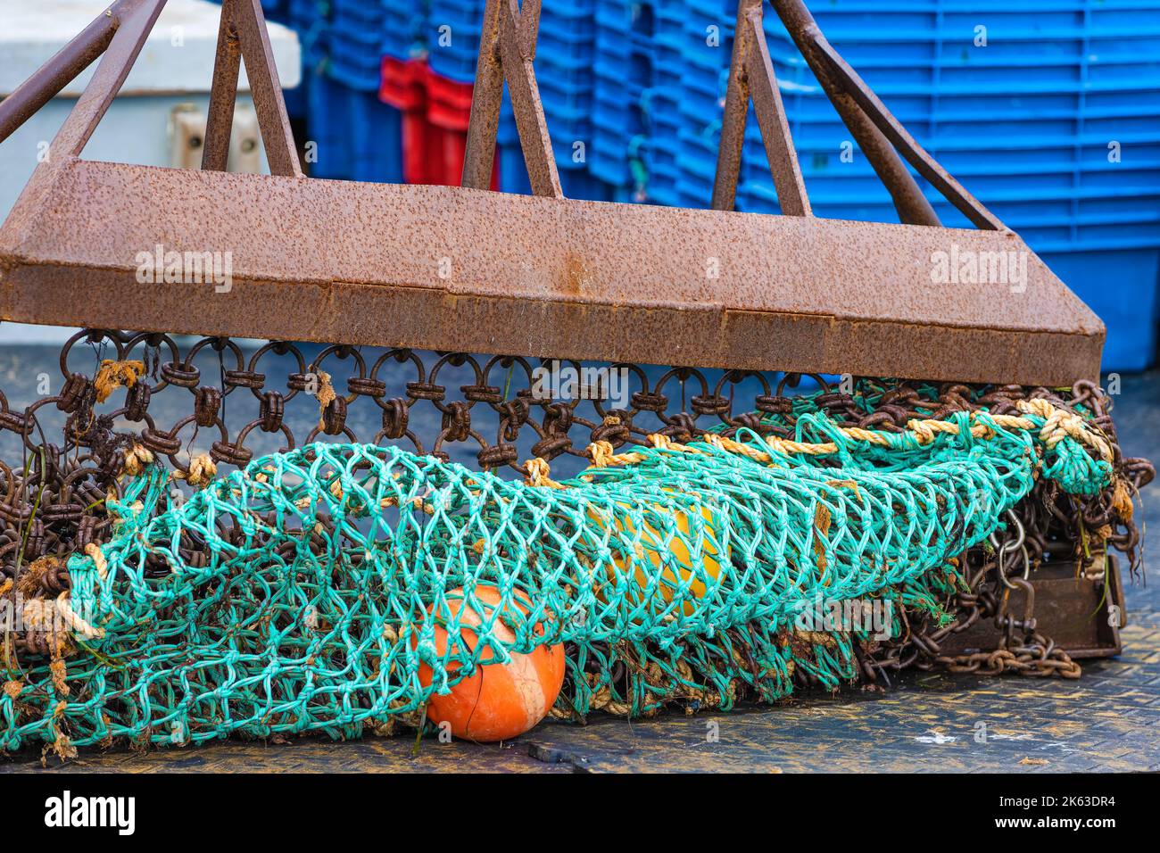 Close up of fishing net and float lying on a dock at Plymouth Harbor, Massachusetts. Stock Photo