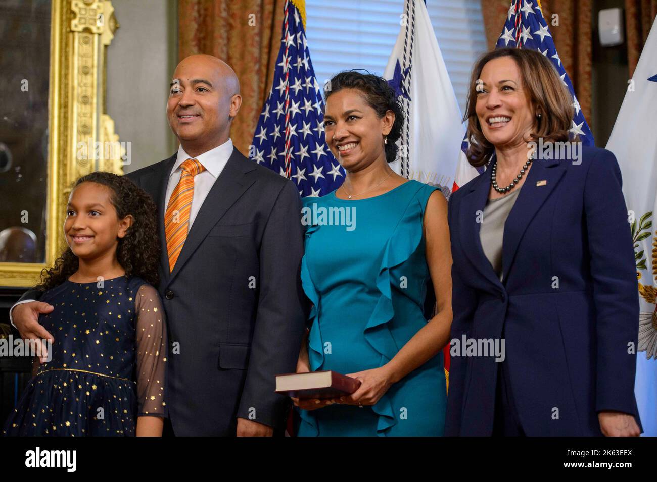 Vice President Kamala Harris (R) smiles with Travis LeBlanc, his wife ...