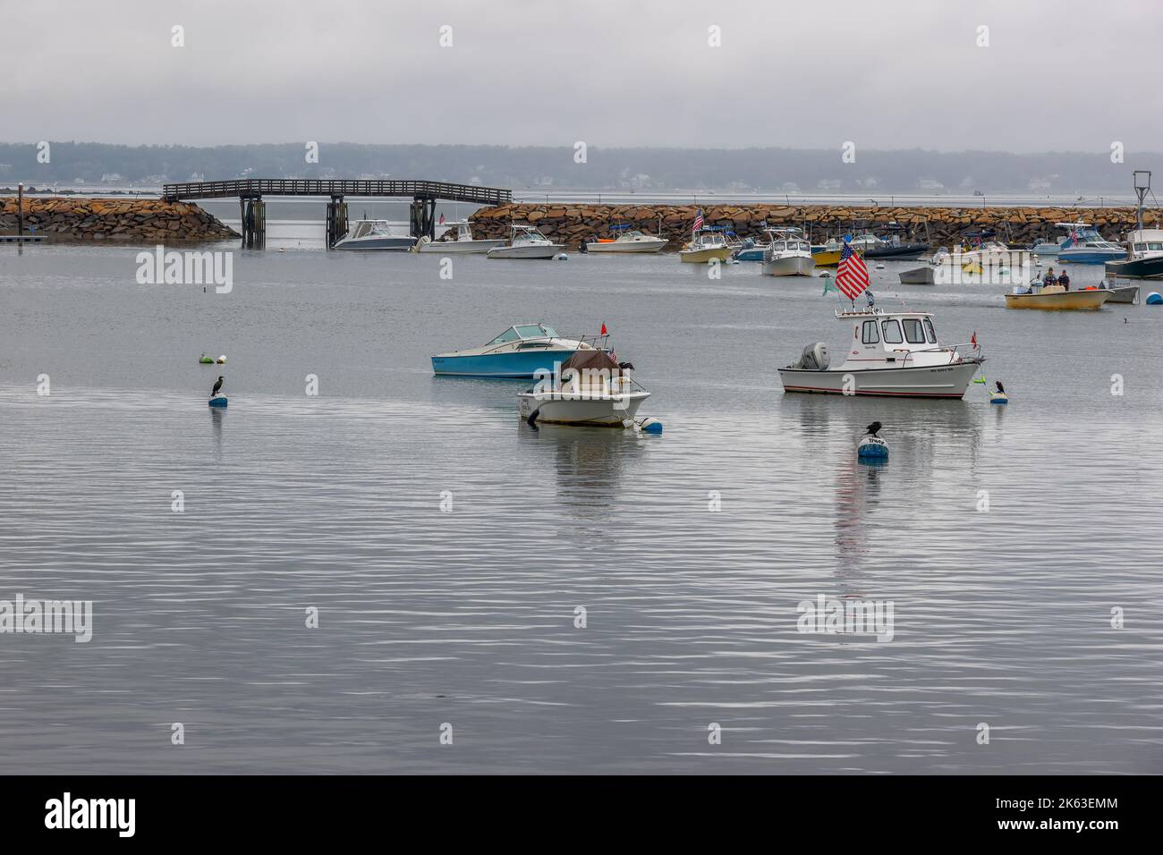 Plymouth, Massachusetts, USA - September 12, 2022: Boats anchored in Cape Bay at Plymouth Harbor. Stock Photo