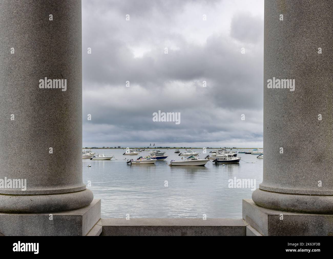 Plymouth, Massachusetts, USA - September 12, 2022: View of the boats anchored in Cape Bay from the rock Momument at Plymouth Harbor. Stock Photo