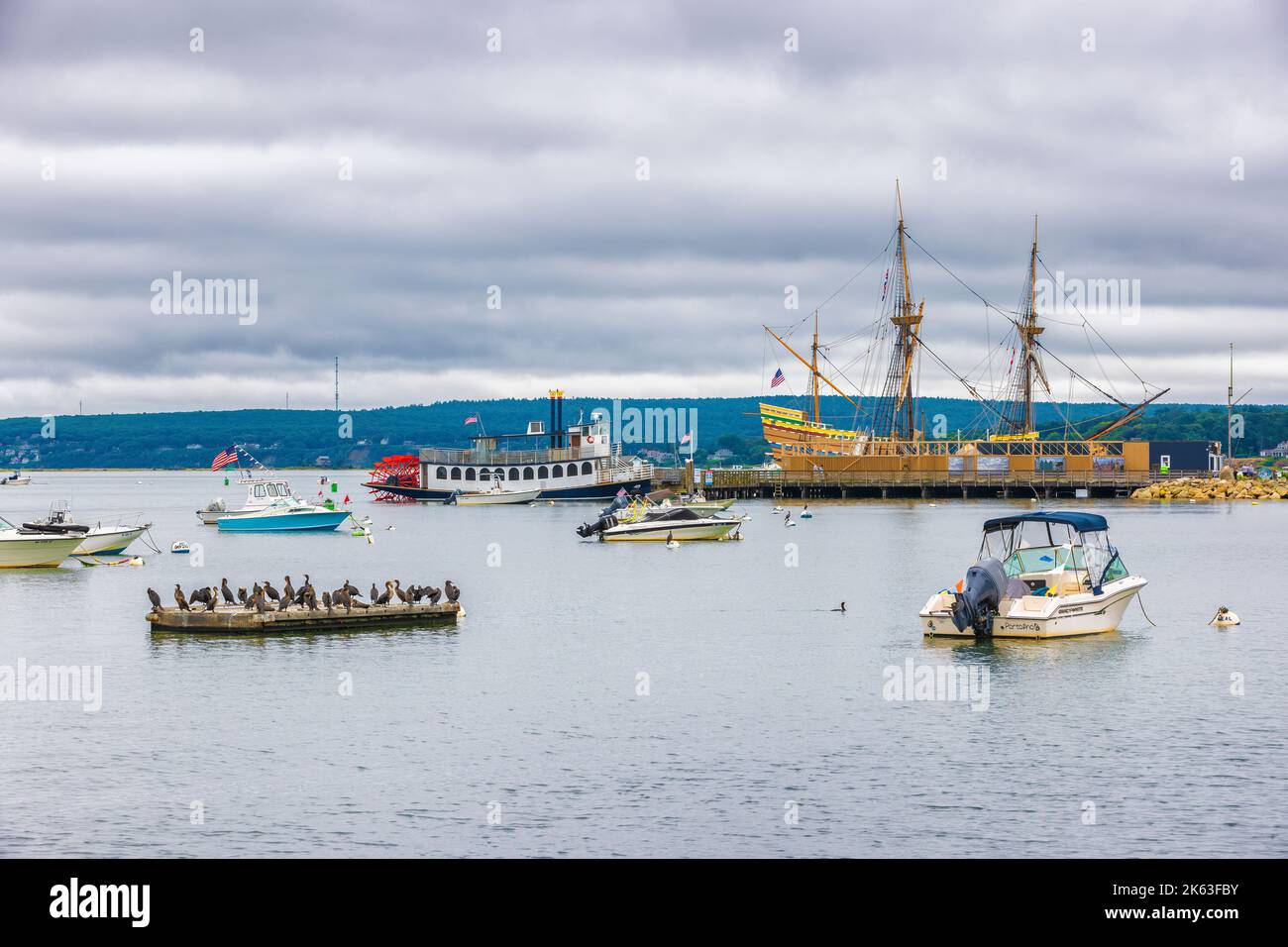 Plymouth, Massachusetts, USA - September 12, 2022: View of Plymouth Harbor where boats are anchored including the Mayflower II in Cape Bay. Stock Photo
