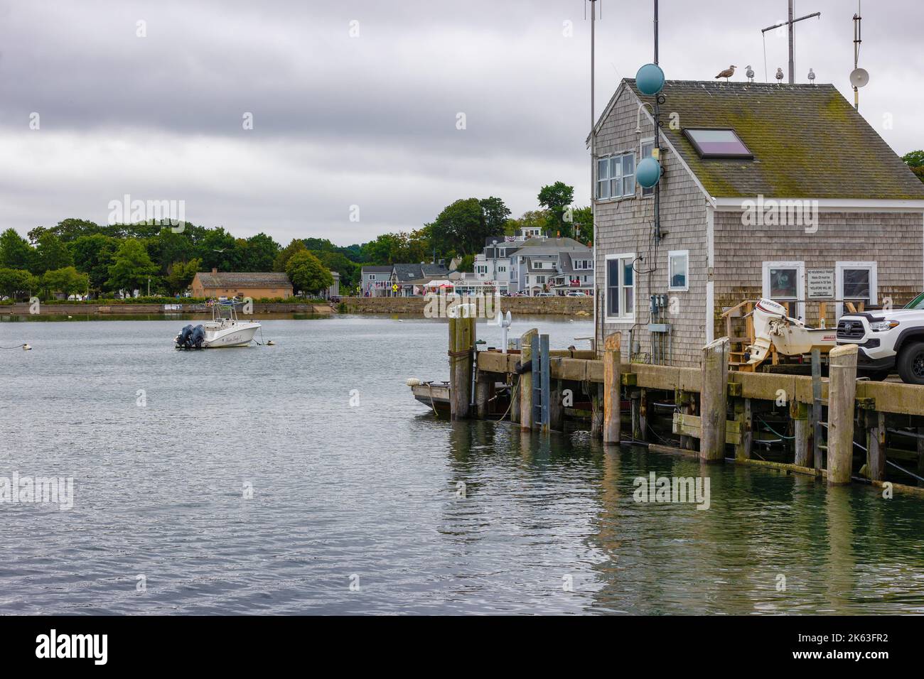 Plymouth, Massachusetts, USA - September 12, 2022:Shoreline, pier and building exterior at Plymouth Harbor. Stock Photo