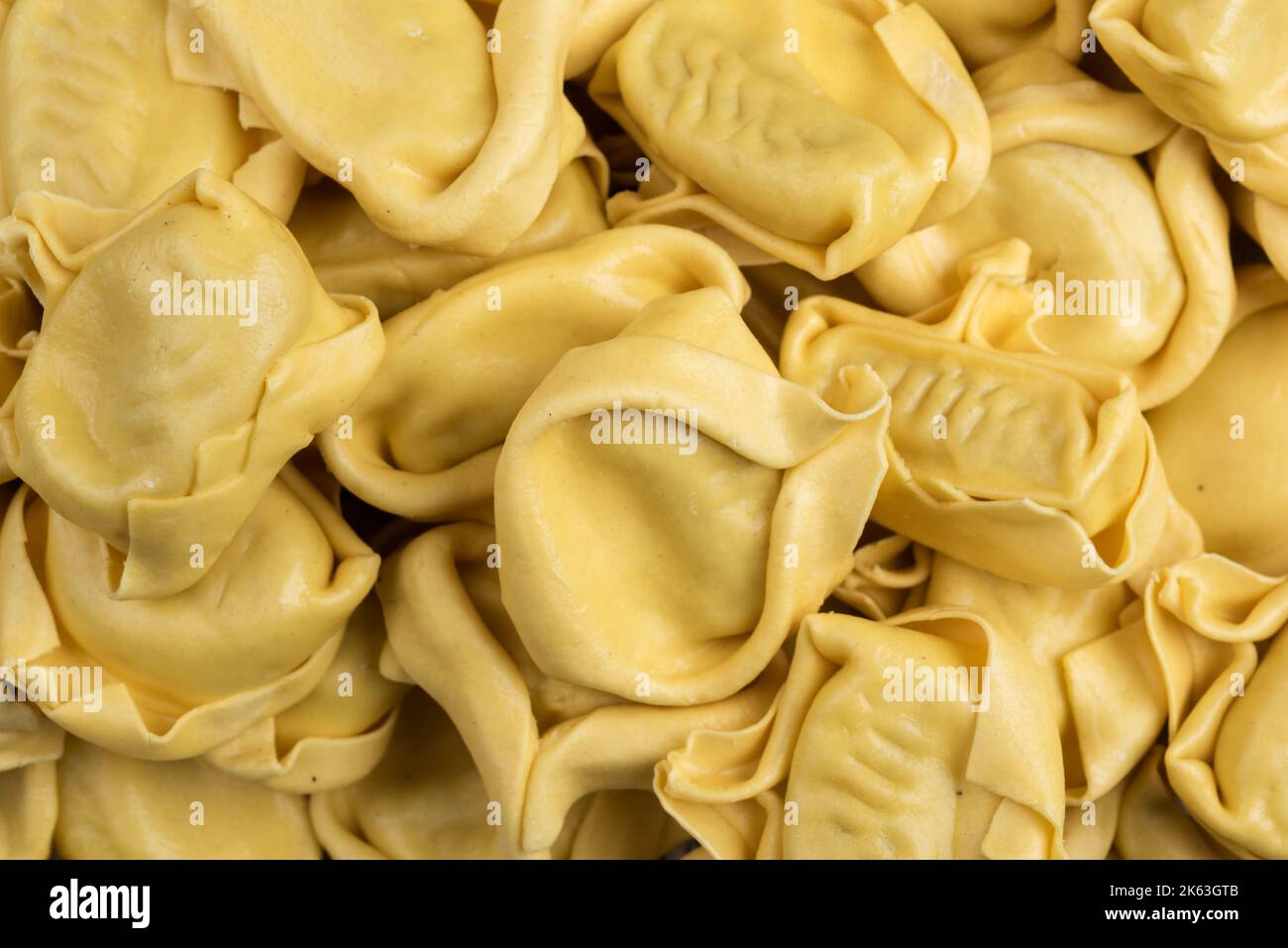 tasted italian food. Quantity of ravioli pasta as a background. Top view style Stock Photo
