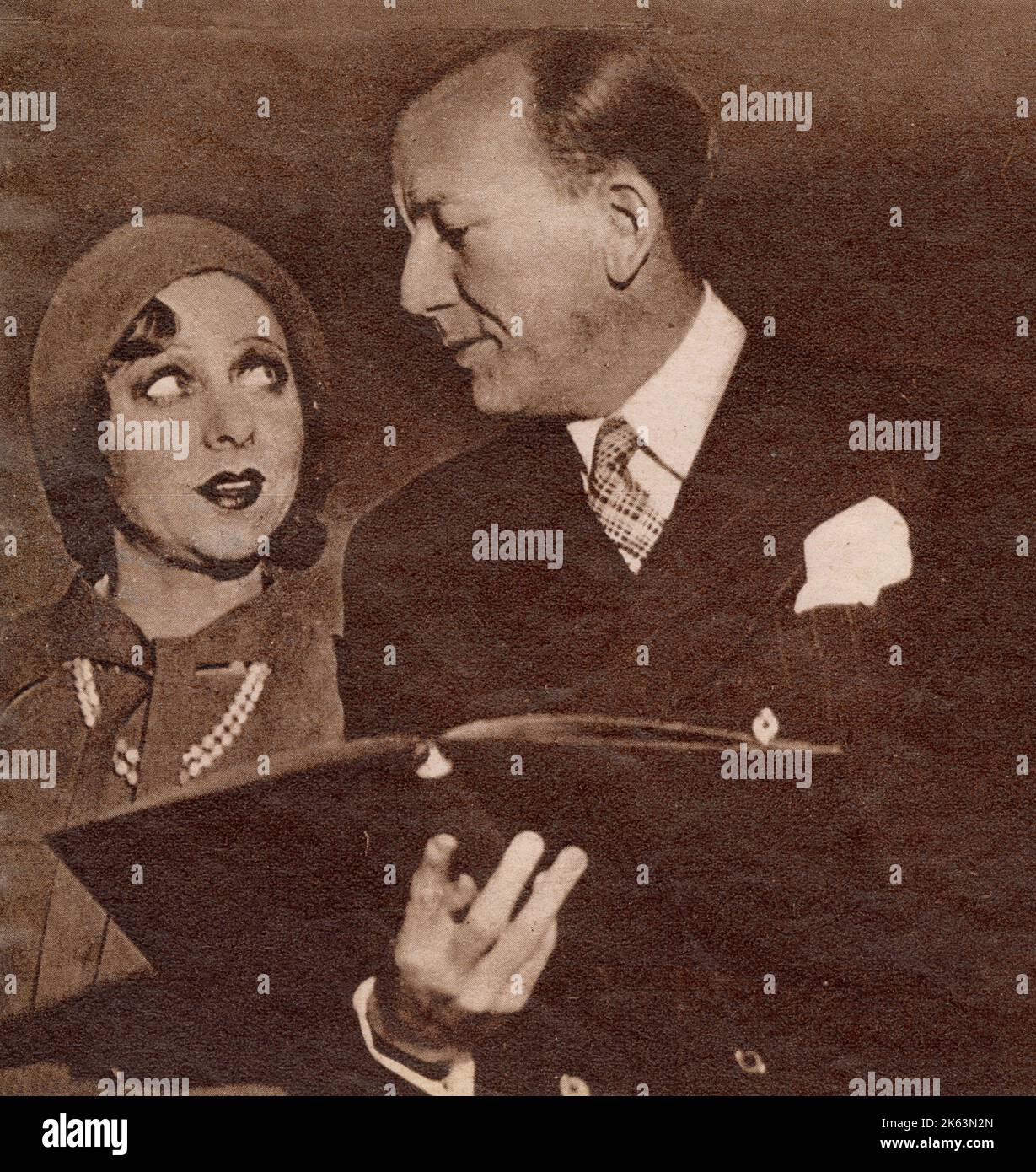 NOEL COWARD (1899 - 1973), actor, playwright and songwriter with the actress Yvonne Printemps. Stock Photo