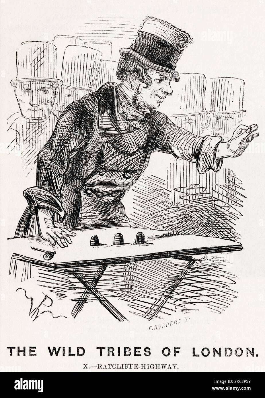 A thimblerigger in a London street tries to trick members of the crowd