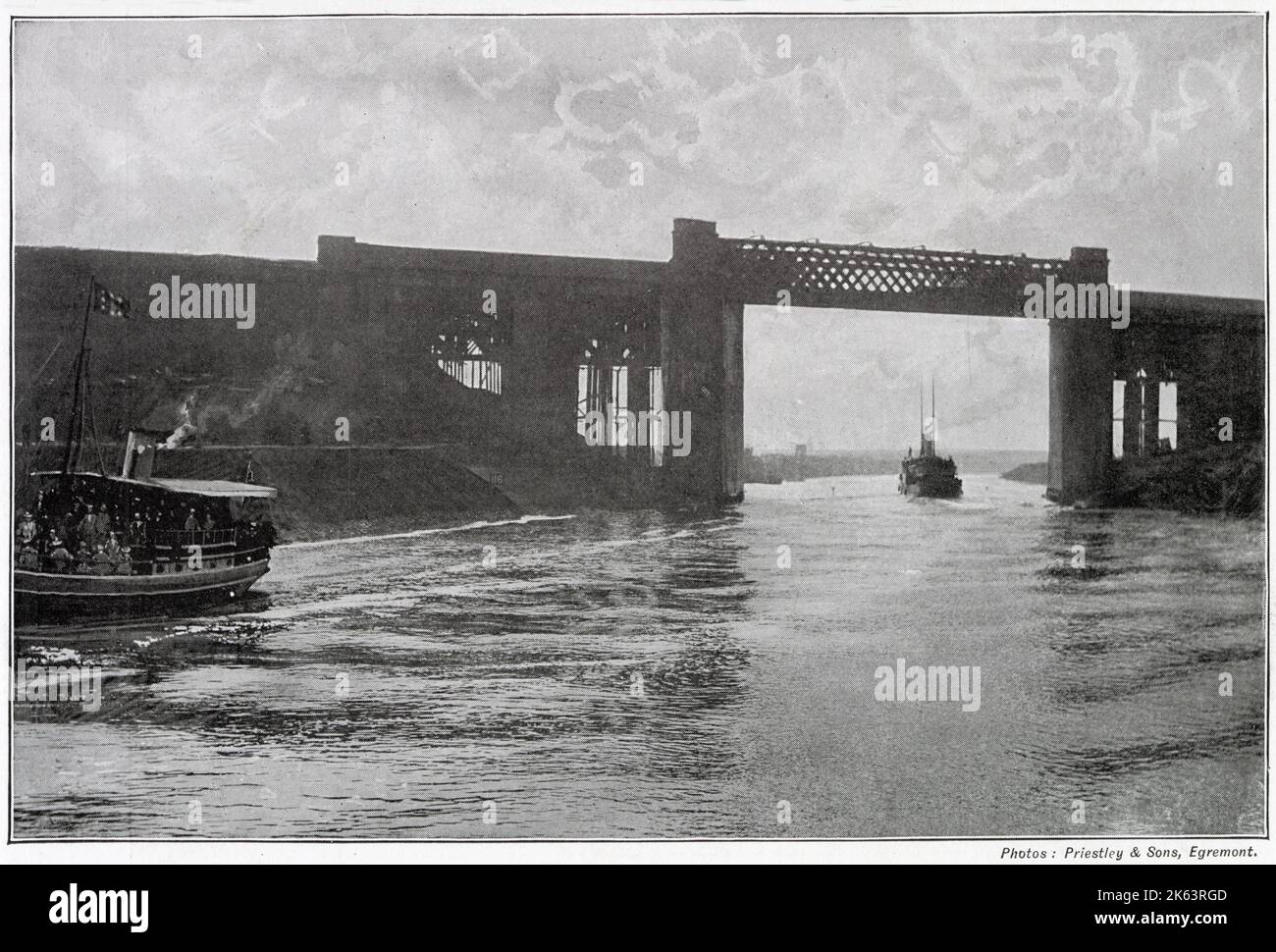 Construction of a canal (36-mile-long) for seagoing ships between the city of Manchester and the estuary of the Mersey had proved to be an engineering undertaking of the first magnitude. Photograph showing the high railway which carries the Cheshire Lines across the Canal at the height of 75 feet above water.      Date: late 1890s Stock Photo