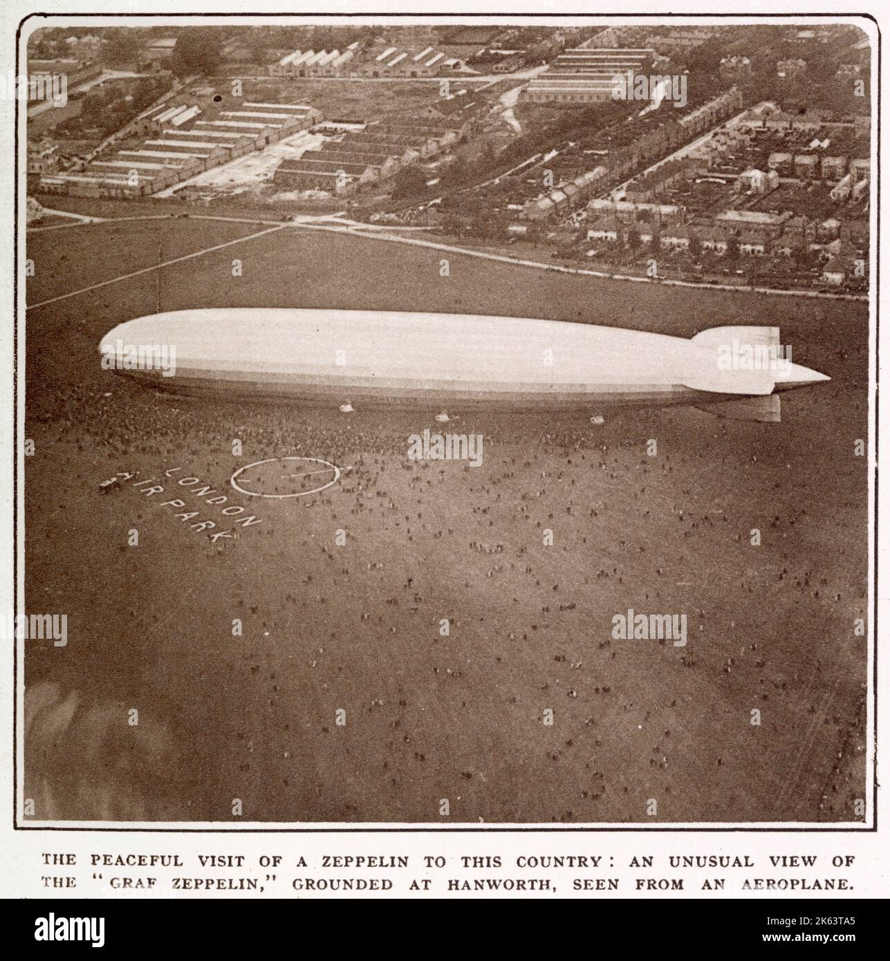 'Graf Zeppelin' leaving Friedrichshafen and appearing over Hanworth Aerodrome on the same day, cruised over Central London, watched by thousands from the ground. Stock Photo