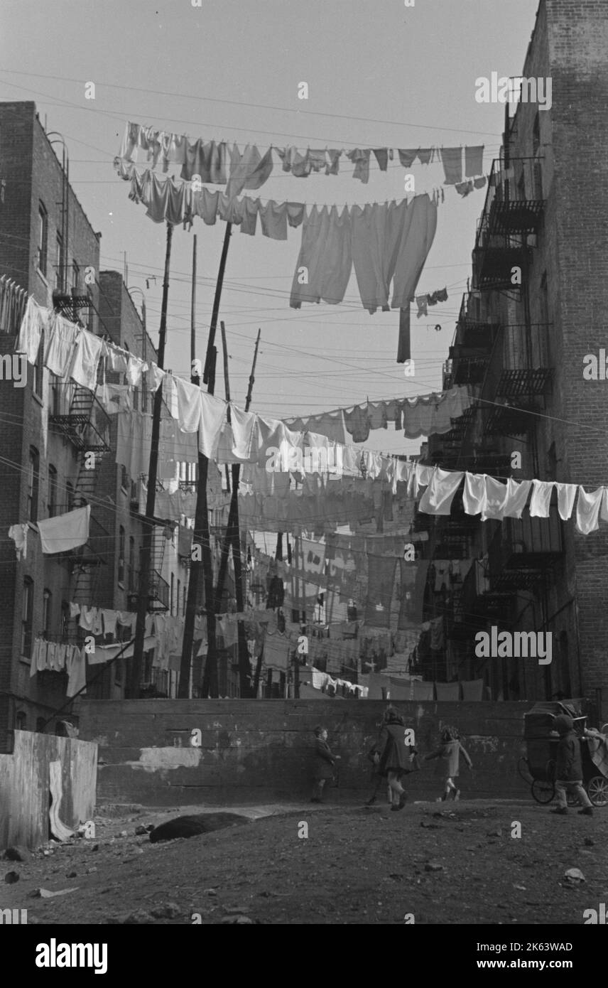 An avenue of clothes washings between 138th and 139th Street apartments, just east of St. Anne's Avenue, Bronx, New York. Date 1936 Nov. Stock Photo