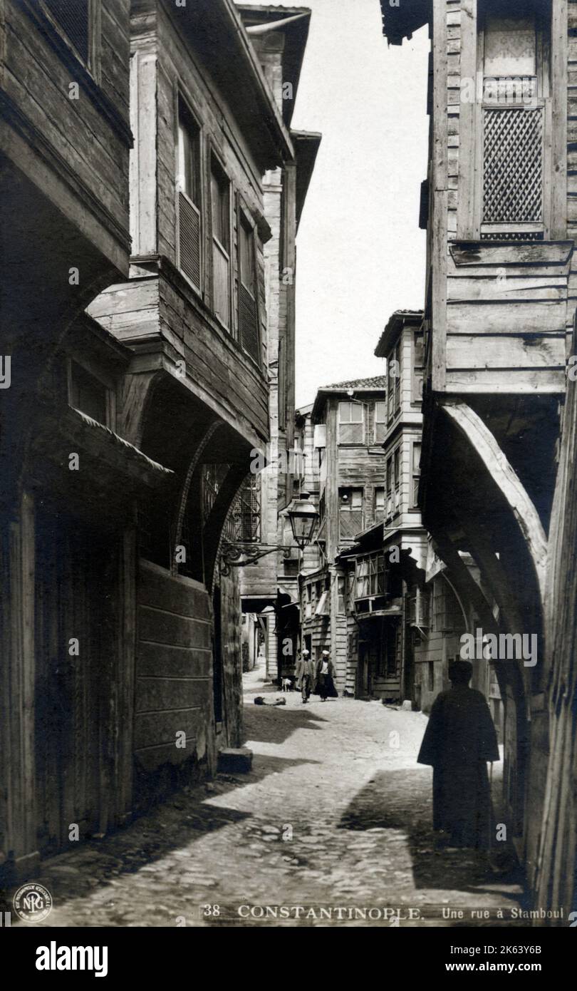 A narrow street between wooden houses, Old Istanbul, Turkey circa 1910s Stock Photo