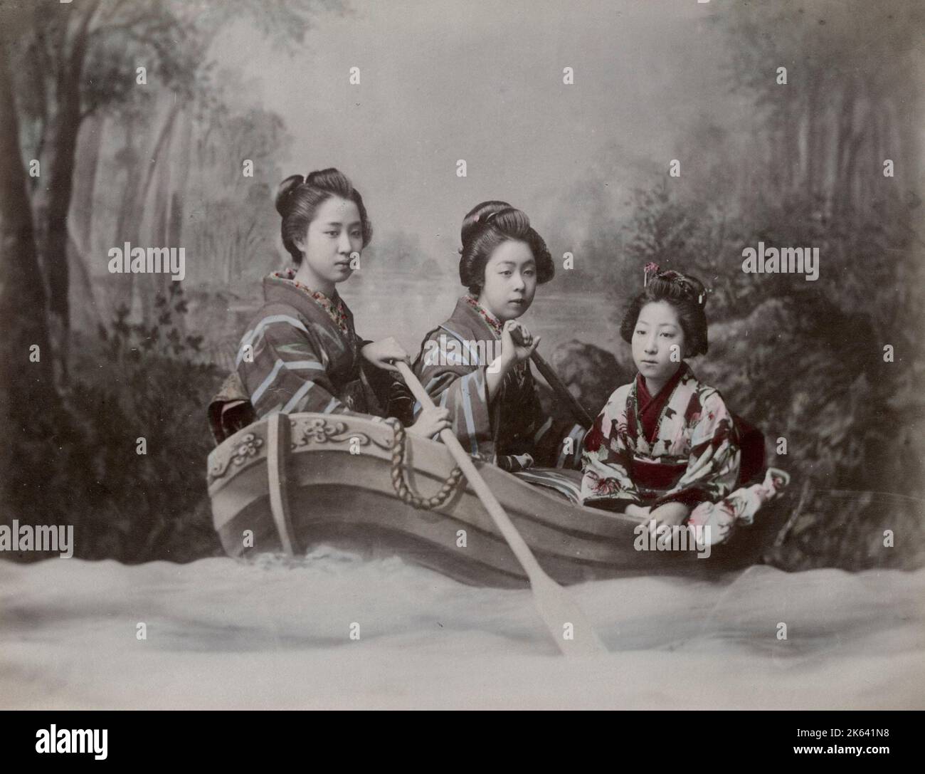 Young women in a rowing boat, studio scene tableau. Vintage 19th century photograph. Stock Photo