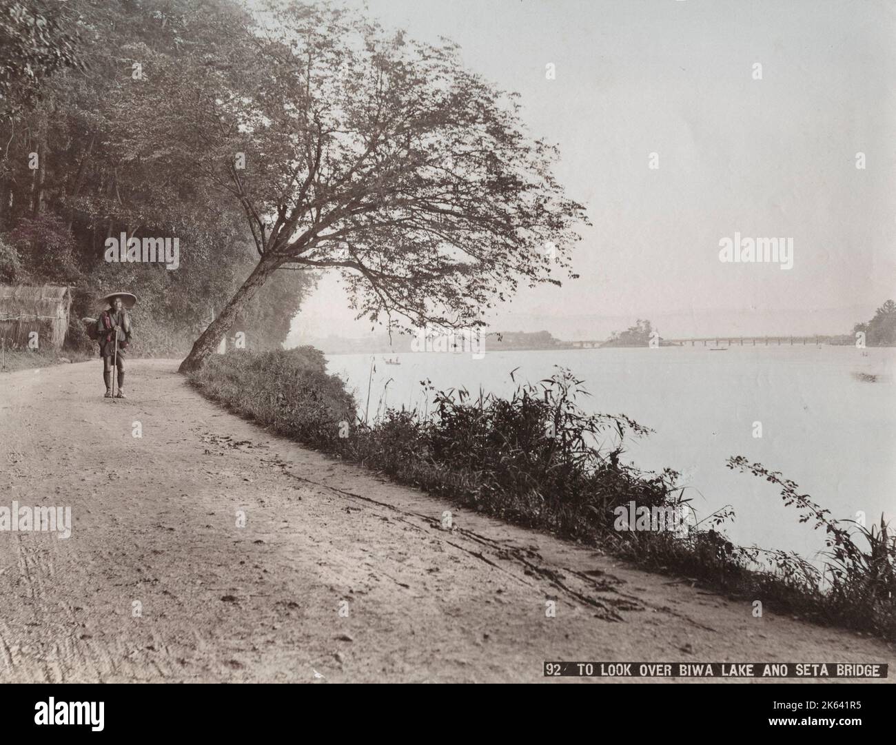 Looking out over Lake Biwa and the Seta Bridge,  near Kyoto, Shiga Prefecture. Vintage 19th century photograph. Stock Photo