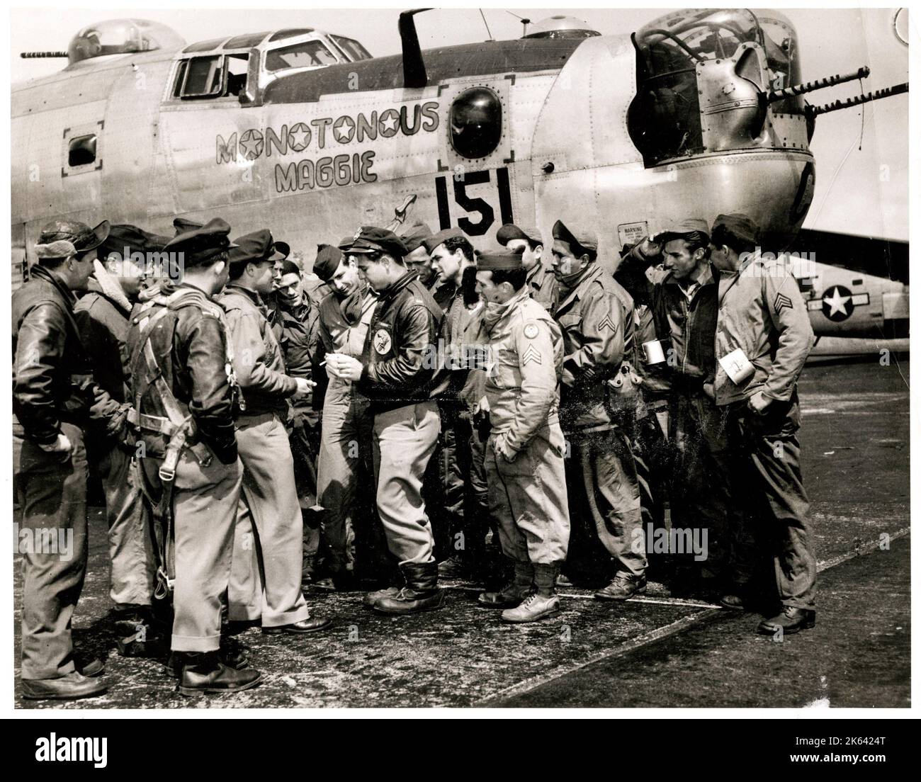 World War II -  US Airforce crew prepare for return to USA following end of war in Europe and possible redeployment in Japan. Bomber named Monotonous Maggie Stock Photo