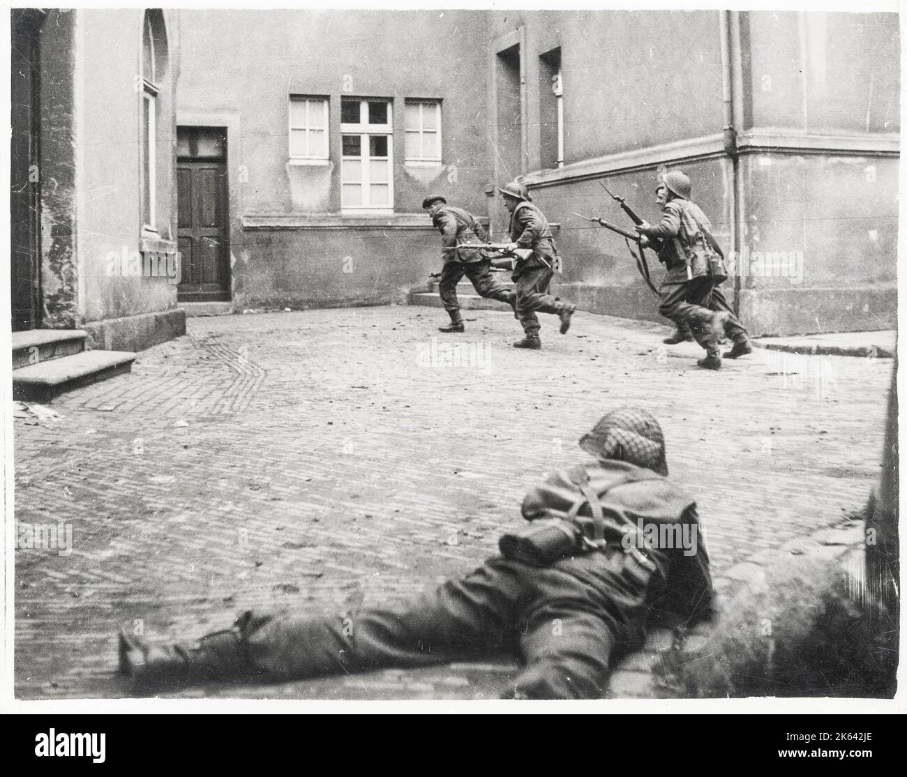 World War II vintage photograph - troops of the Wnd British Army take Lingen, Germany Stock Photo