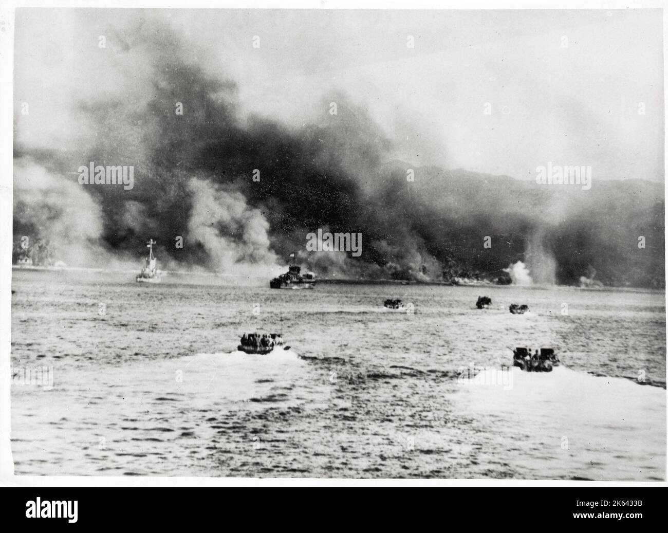 Vintage World War II photograph - US Navy landing craft head towards the shore of Cebu island in the Philippines, war in the Pacific Stock Photo