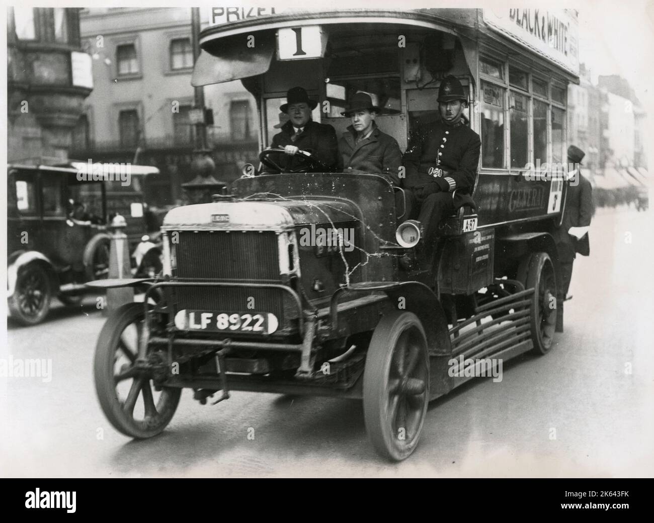 General Strike - Policeman riding with volunteer bus drivers. The barbed wire on the bonnet is to stop protestors damaging the engine. The strike lasted 9 days between 4th and 12th May, 1926.     Date: 1926 Stock Photo
