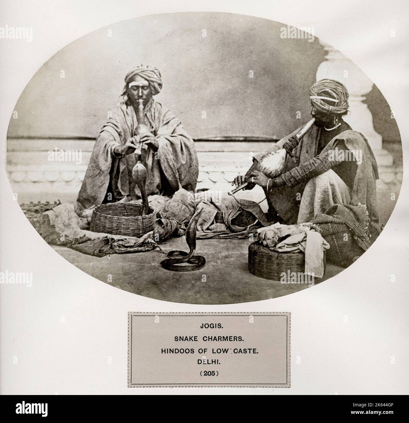 The People of India: A Series of Photographic Illustrations, with Descriptive Letterpress, of the Races and Tribes of Hindustan - published in the 1860s under order of the Viceroy, Lord Canning - Jogis, snake charmers, Hindoos of low caste, Delhi. Hindu. Stock Photo
