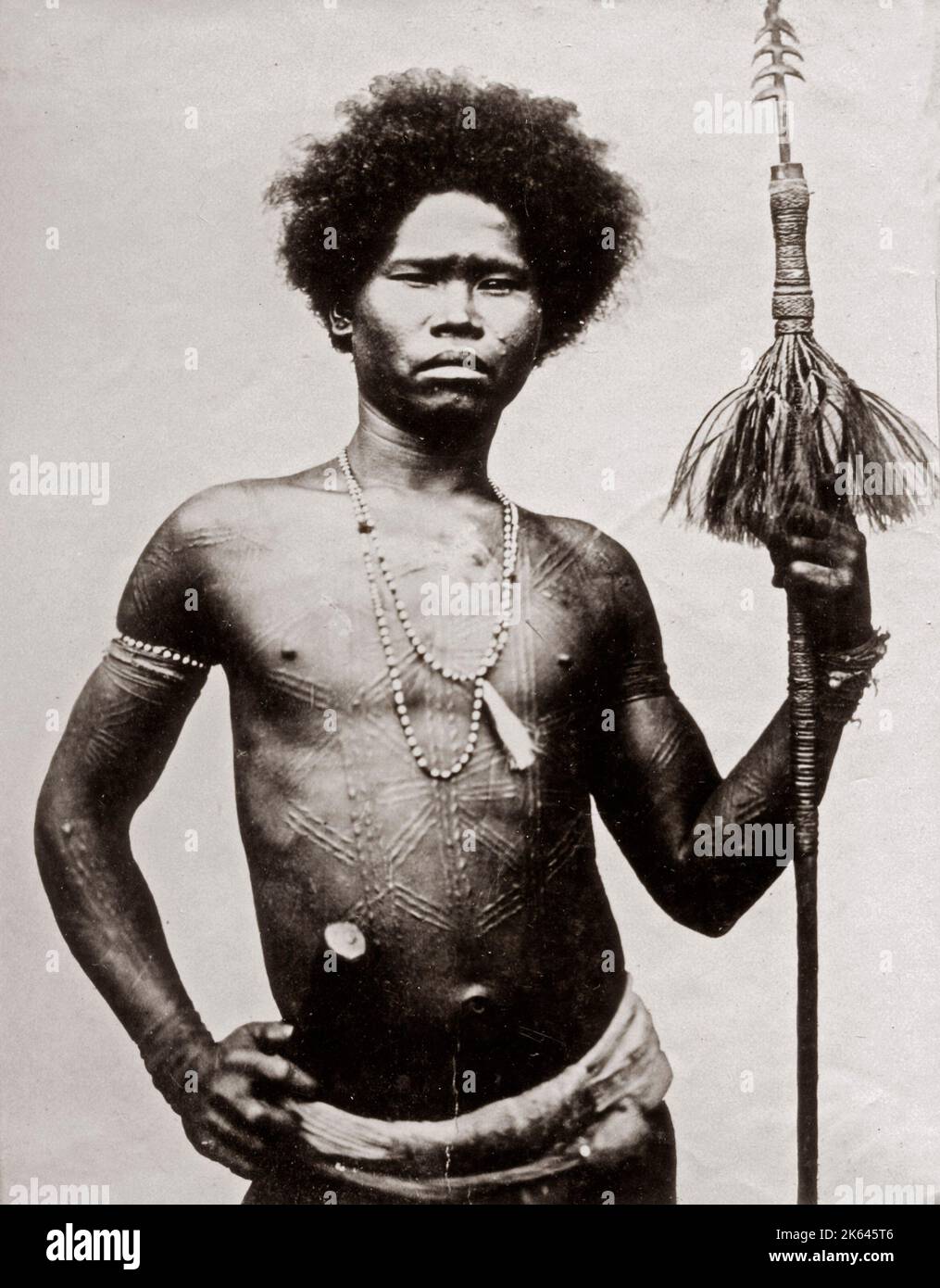c.1880s South East Asia - probably the Philippines - man with decorative or ritual scarring and a spear Stock Photo