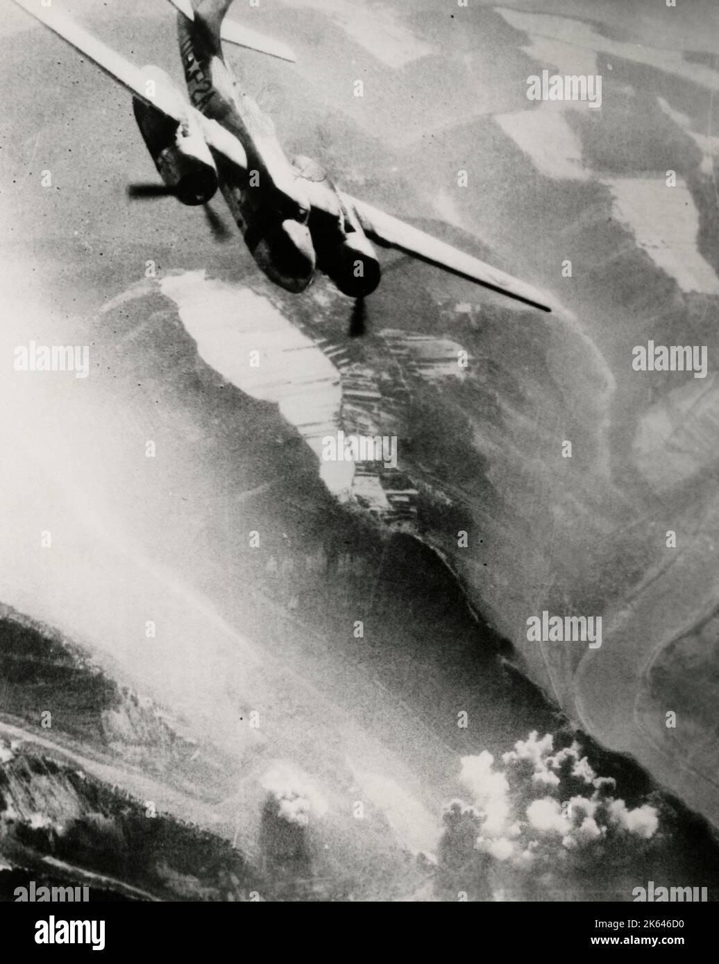 Vintage World War II photograph - official US Navy photo: US 9th Airforce Douglas A-26 Invader having dropped its bombs on a bridge over the Moselle River, Germany, 1944. Stock Photo