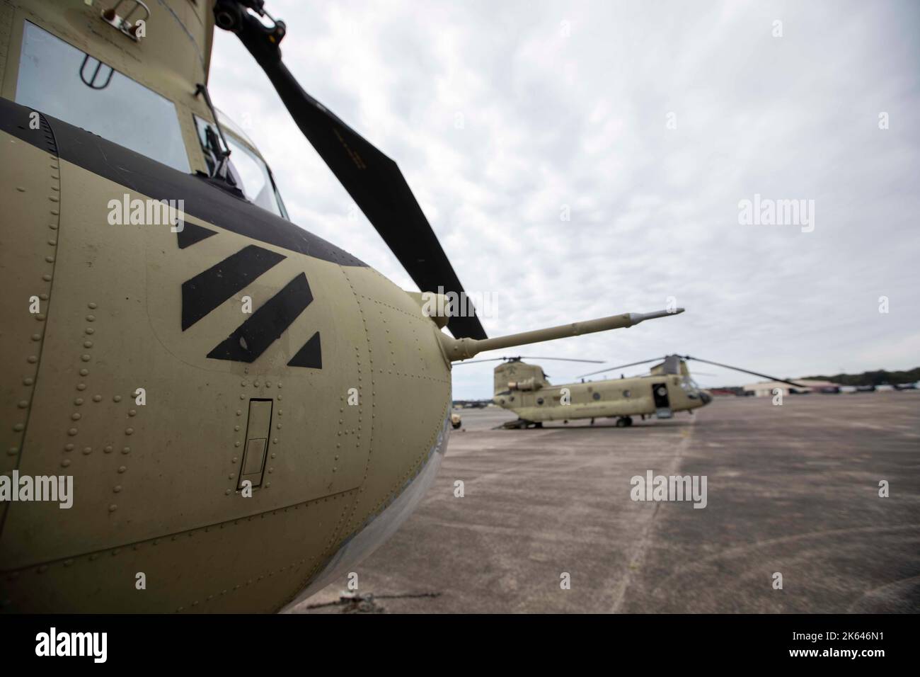 A CH-47 Chinook sits on the flightline at Hunter Army Airfield, Georgia, prior to being evacuated for Hurricane Ian on September 28, 2022. Evacuating some aircraft to Fort Benning, Georgia and hangaring the rest of the fleet allowed the brigade to maintain readiness while keeping Soldiers and equipment safe but able to spring into action for follow-on missions if needed. (U.S. Army photo by Sgt. Savannah Roy / 3rd Combat Aviation Brigade, 3rd Infantry Division) Stock Photo