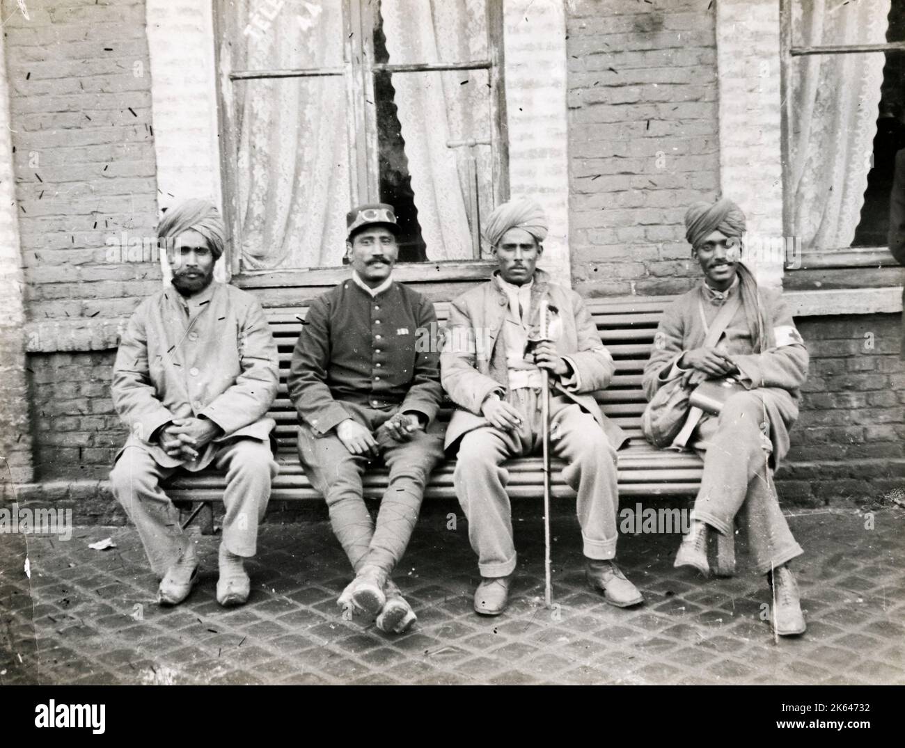 Vintage World War One photograph - WWI: Indian soldiers outside French cafe. Stock Photo