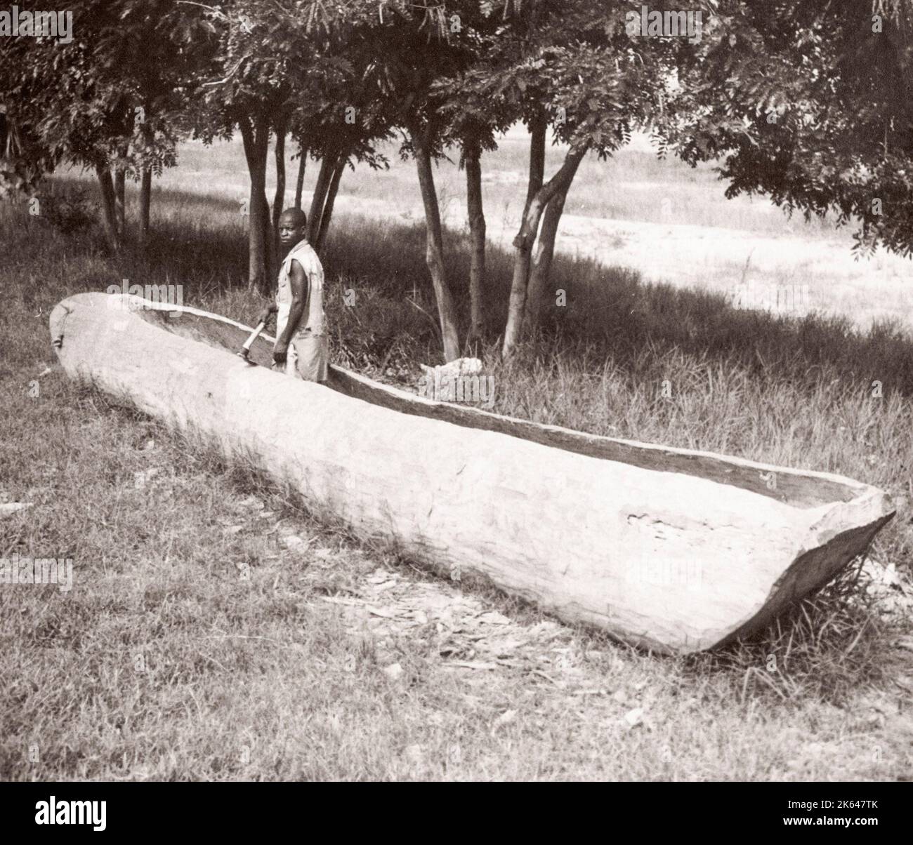 1940s East Africa Uganda making a dugout canoe, Butiaba, Lake Albert Photograph by a British