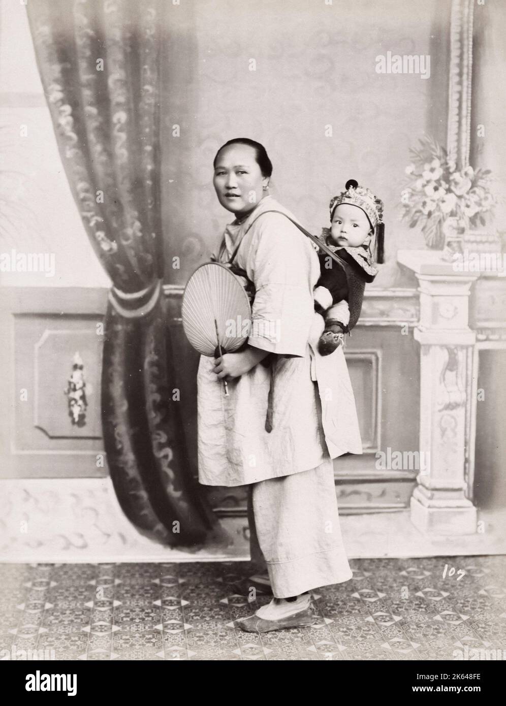 Vintage 19th century photograph Chinese woman carrying a baby on her