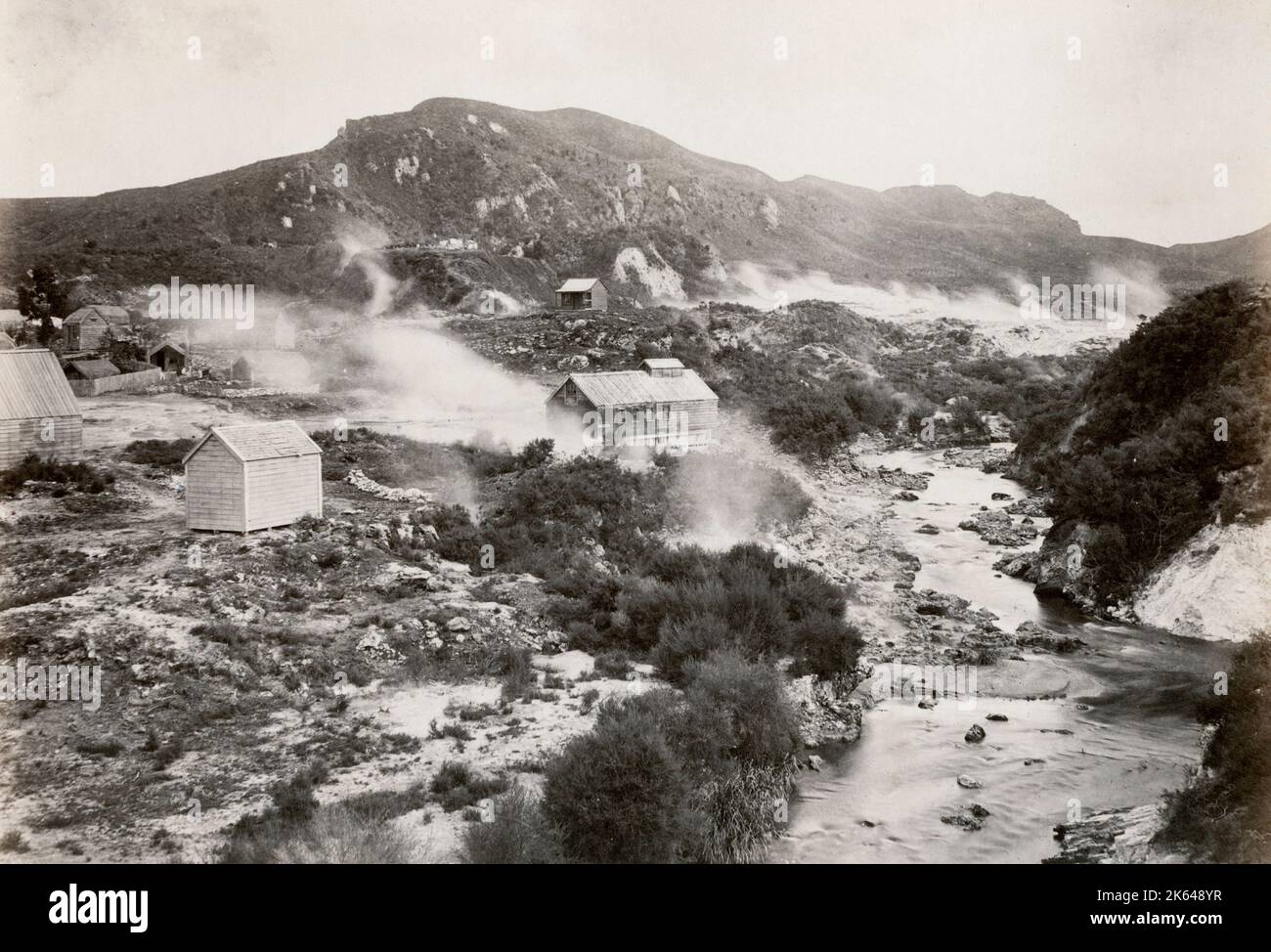 19th century vintage photograph - view of Whakarewarewa c.1880's. This is now is a sprawling area home to the Te Puia geothermal preserve, with its Maori cultural centre, bubbling mud pots, and the spouting Pohutu Geyser. Stock Photo