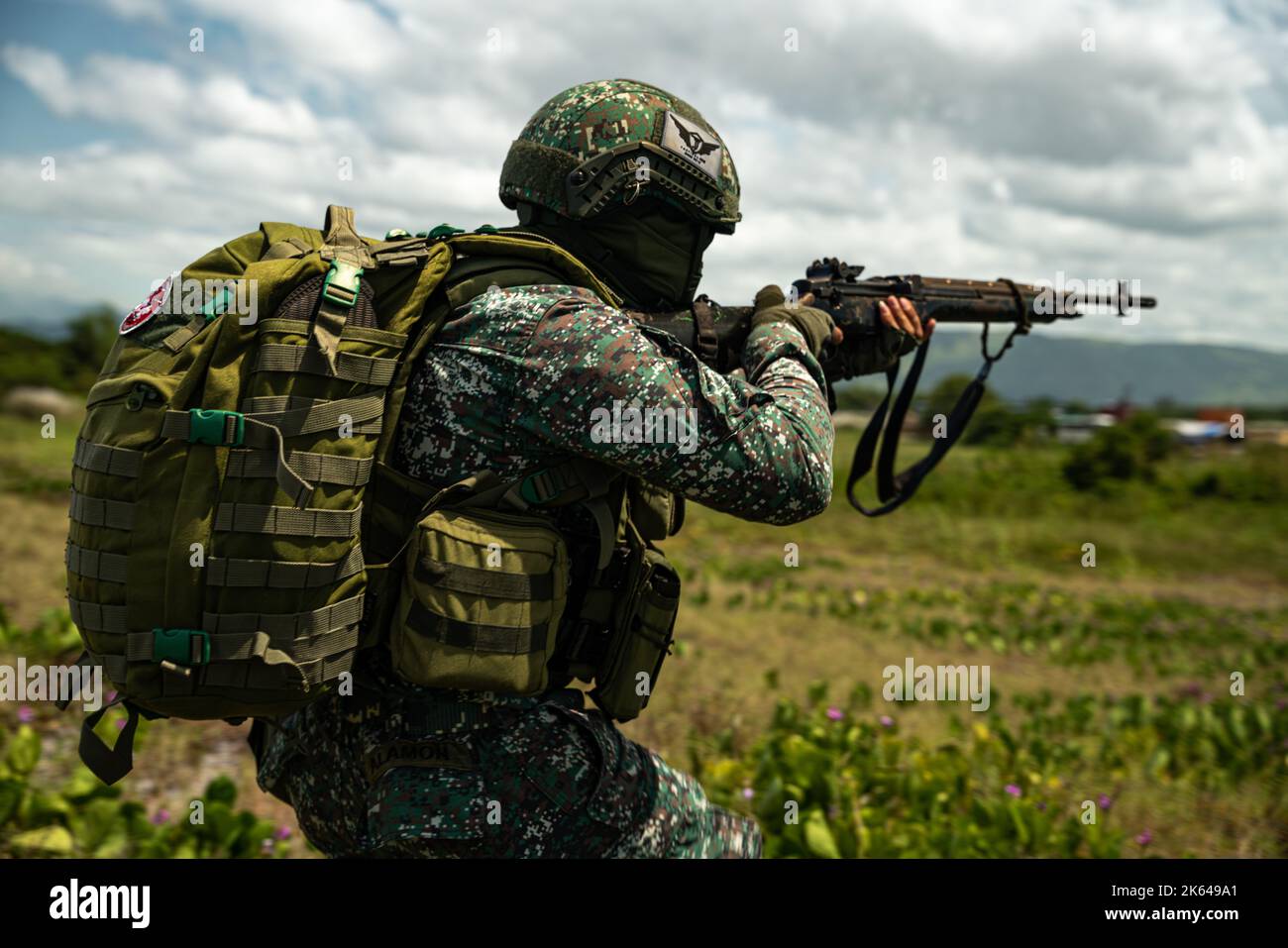 A Philippine Marine advances toward the objective following an amphibious landing during KAMANDAG 6, Zambales, Philippines, Oct. 7, 2022. KAMANDAG is an annual bilateral exercise between the Armed Forces of the Philippines and U.S. military designed to strengthen interoperability, capabilities, trust, and cooperation built over decades of shared experiences. (U.S. Marine Corps photo by Cpl. Ujian Gosun) Stock Photo