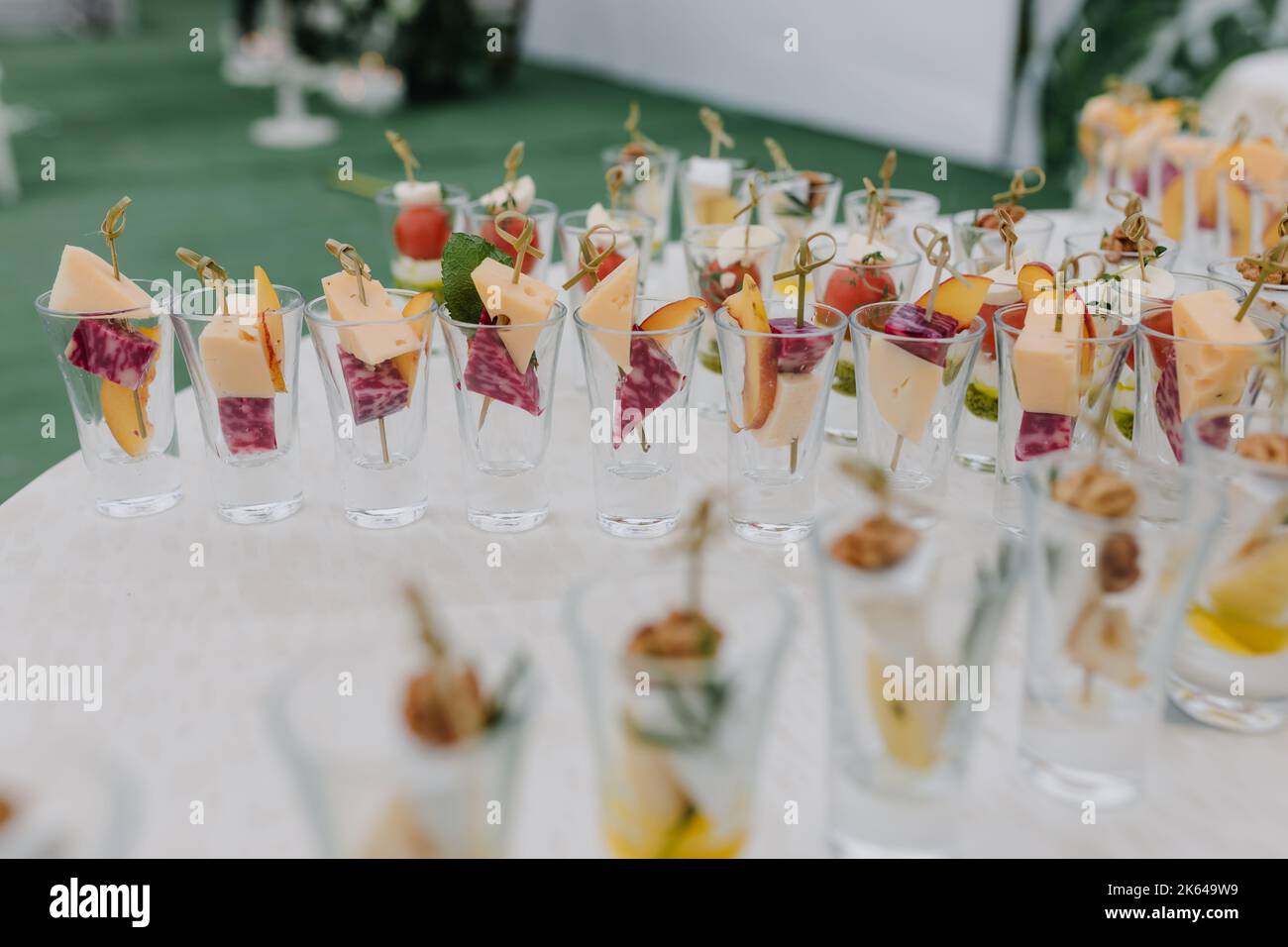 Snacks on the holiday with toothpicks in glasses. Side view Stock Photo