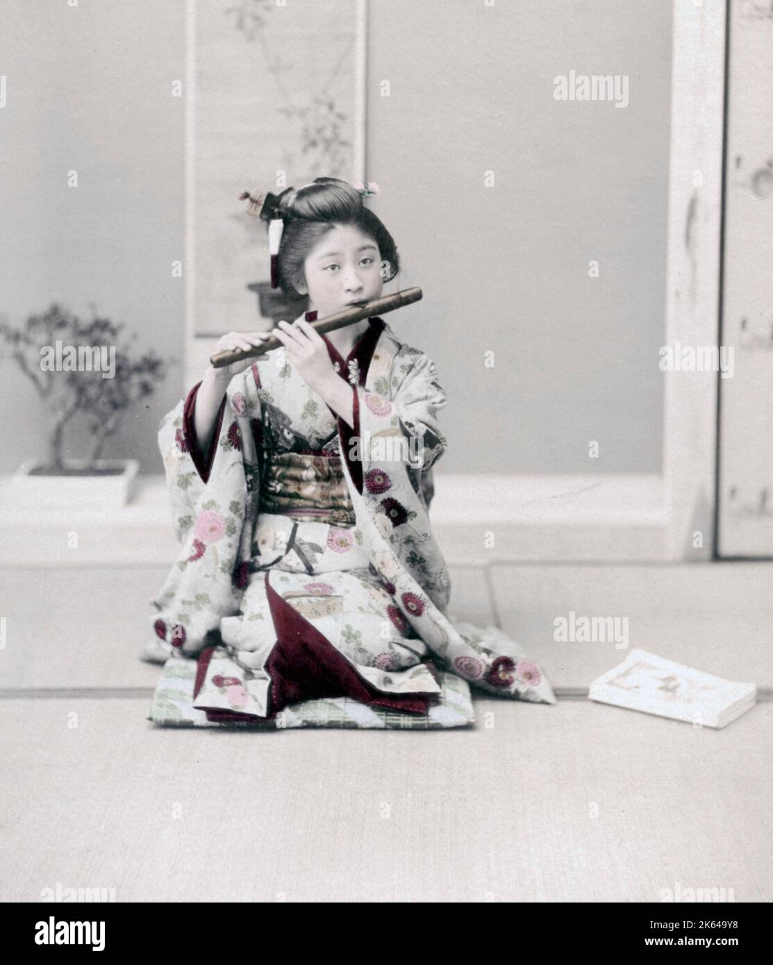 Girl playing a flute, Japan, c.1890 Vintage late 19th century photograph Stock Photo Alamy