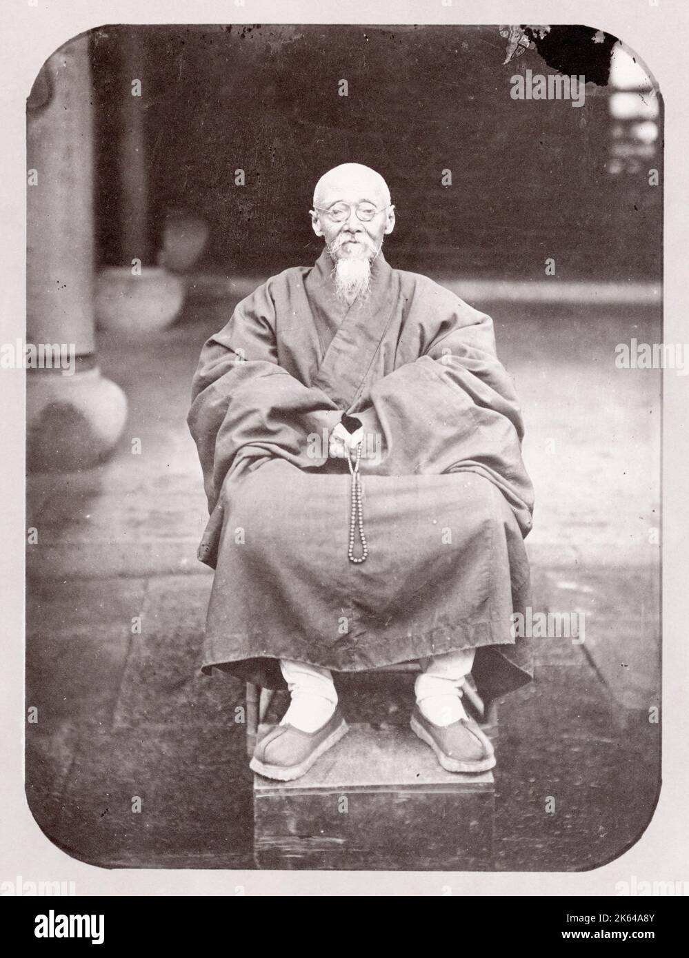 Vintage late 19th century photograph: Elderly Chinese man of status, China. Stock Photo