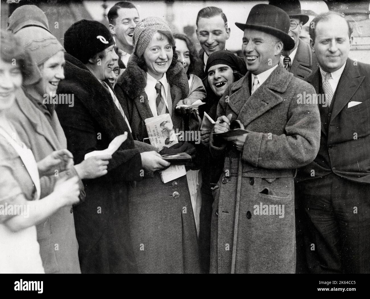 Actor Charlie Chaplin on his return to the UK in 1931, see signing autographs Stock Photo
