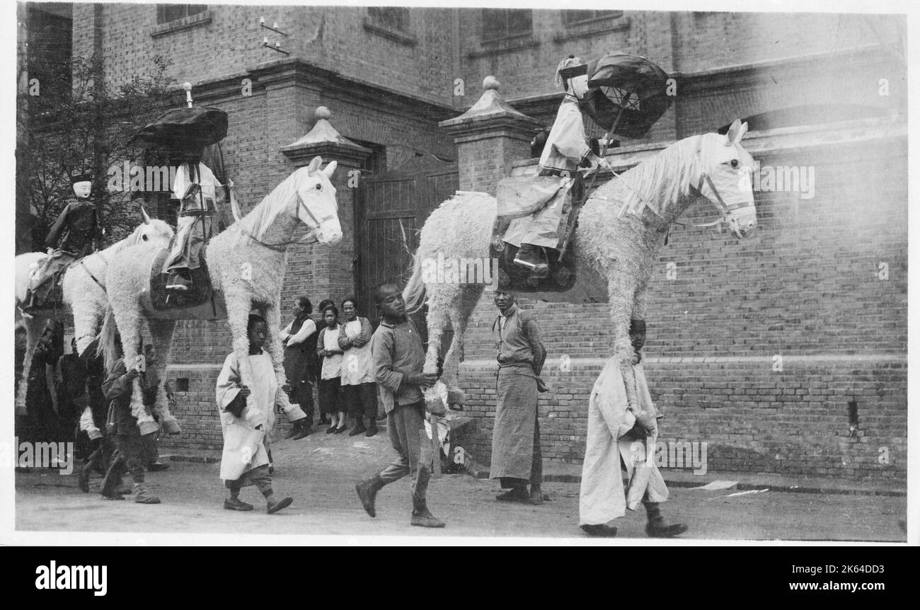 Huge papier mache type horses for a festival, China, c.1910 Stock Photo