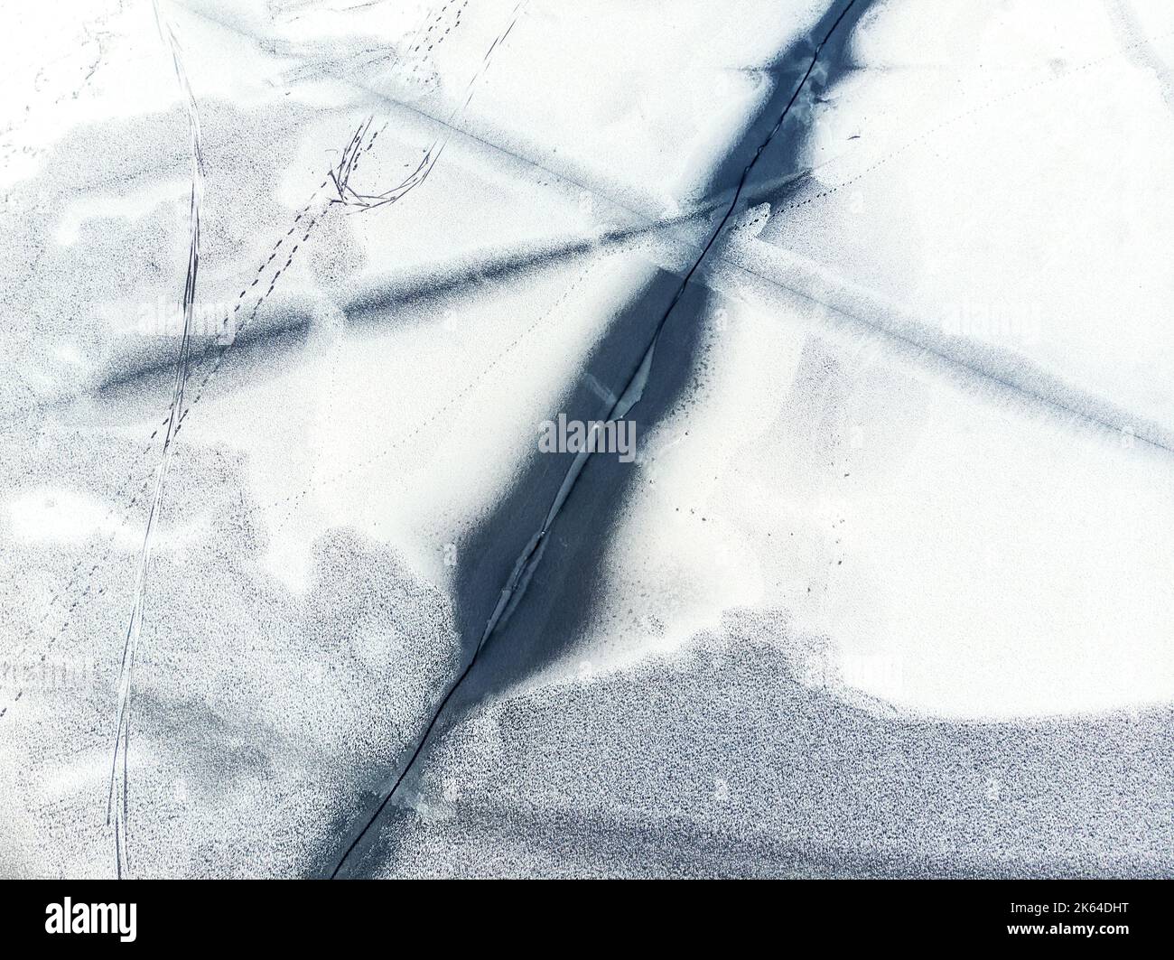 Flying above frozen lake cracked hi-res stock photography and images ...