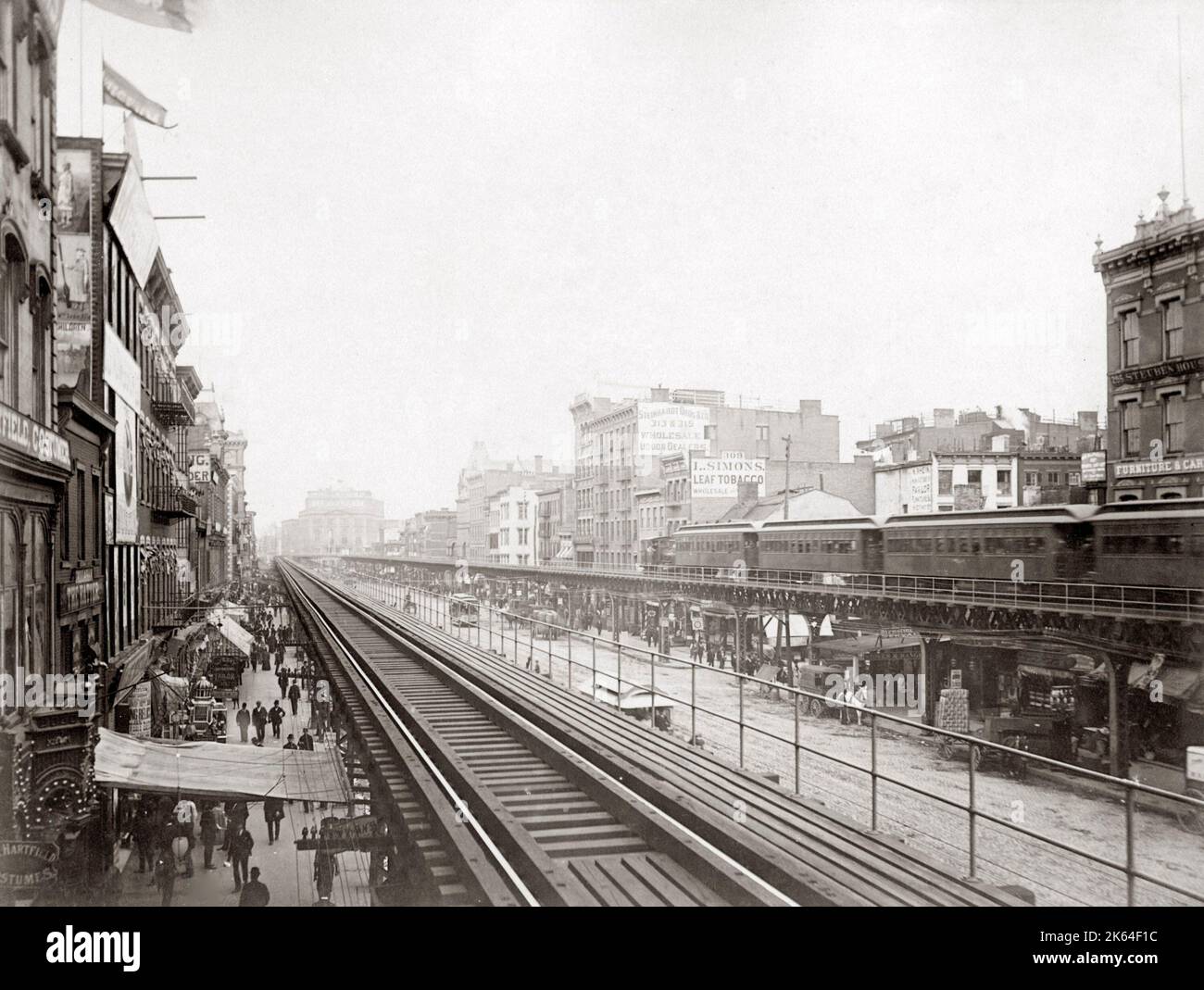 'El Train' railroad New York, c.1900 View in the Bowery, north of Houston Street Stock Photo
