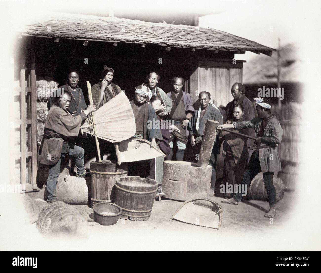 1860's Japan - portrait of a group pounding rice Felice or Felix Beato (1832 - 29 January 1909),  Italian-British photographer working mostly in India, Japan, China Stock Photo