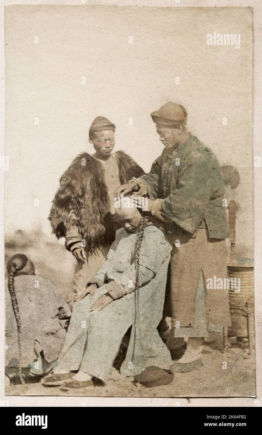 Vintage 19th century photograph: John Thomson carte de visite China: street barber Stock Photo