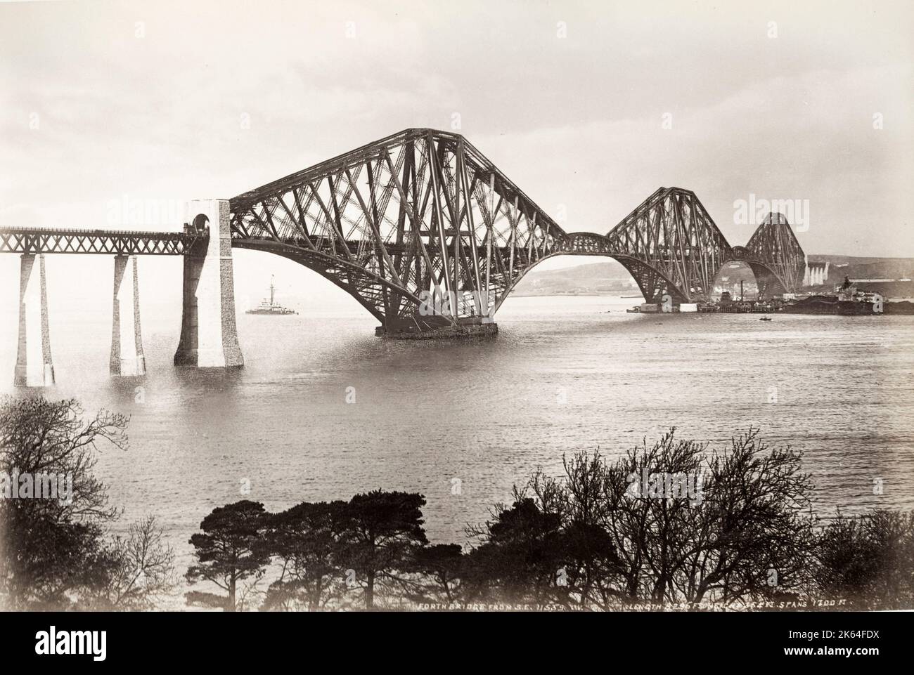 19th century vintage photograph: view of the railway bridge over the Firth of Forth, Scotland, seen from the south bank of the river. c.1890's. Stock Photo