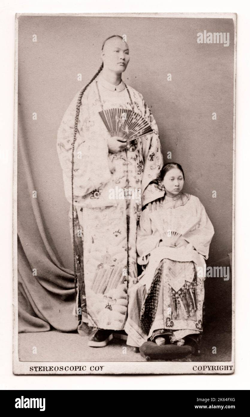 Chang Woo Gow, or 'Chang the Chinese Giantâ circus, show performer in the west, likely photographed with his first wife Kin Foo, c.1860's.. Stock Photo