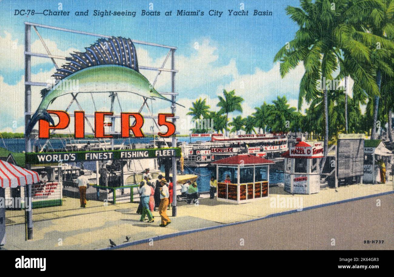 Charter and Sightseeing boats at Miami City Yacht Basin, Miami, Florida, USA - Advertising sign for Pier 5 'World's Finest Fishing Fleet'. Stock Photo